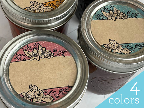 Three mason jars with Kraft Flower Bouquet Canning Labels on the lids. Polka dot floral labels are colored pink, blue, and orange | CanningCrafts.com