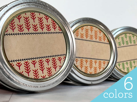 Three mason jar lids with different colored patterned labels | CanningCrafts.com