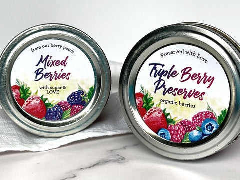 Custom Watercolor Triple Berry Canning Labels on mason jar lids. Label artwork has a mix of strawberry, blueberry, blackberry, and raspberry artwork | CanningCrafts.com