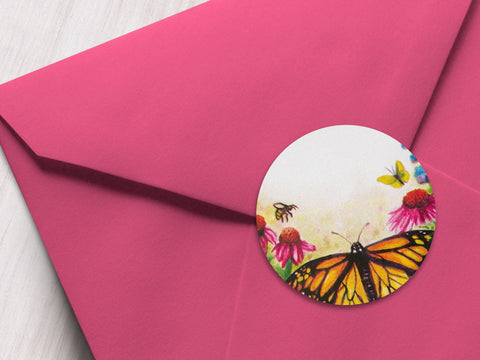 Round printed watercolor butterfly labels on a pink envelope | CanningCrafts.com