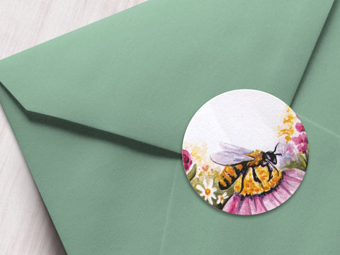 Round printed watercolor wildflower  honey bee labels on a green envelope | CanningCrafts.com